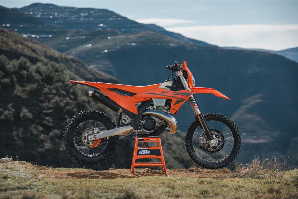 2025 KTM EXC RANGE on a stand with mountains in background